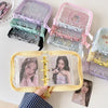 A collection of glitter star card binders in purple and pink, showing various collectible cards.