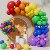 A colorful balloon garland arch kit featuring red, orange, yellow, and green balloons arranged in a decorative display.