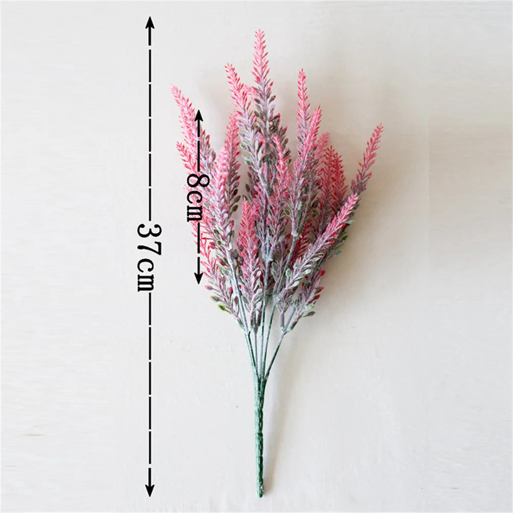 A vertical arrangement of pink and purple lavender artificial flowers with a measuring scale.