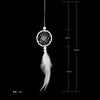 A feather pendant charm with a circular mirror design suspended by a thin cord.