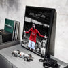 A framed poster featuring Cristiano Ronaldo in a red jersey and white shorts against a dark background.