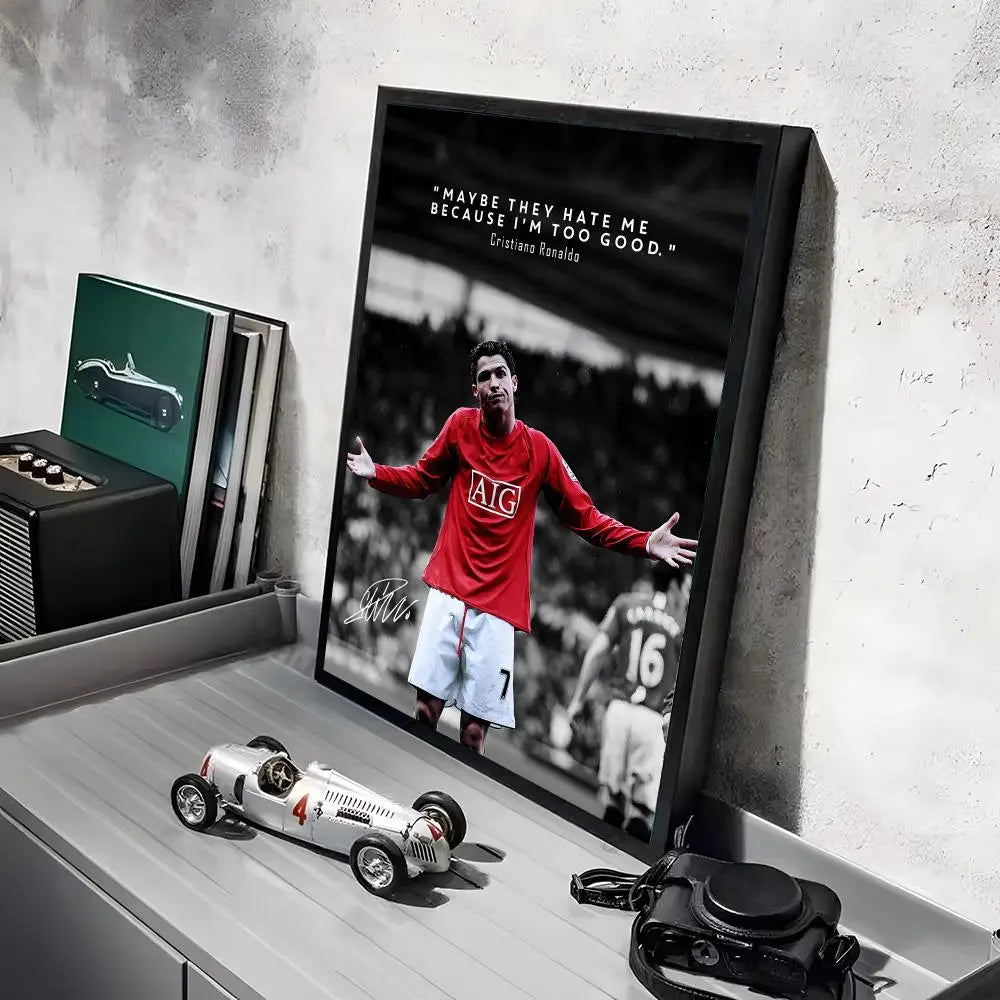 A framed poster featuring Cristiano Ronaldo in a red jersey and white shorts against a dark background.