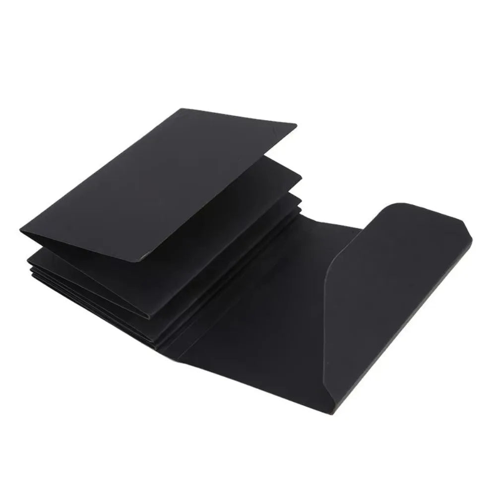 Black accordion folding photo album displayed at an angle.