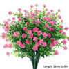 Un bouquet de fleurs artificielles roses et vertes pour décoration d'automne ou d'Halloween.