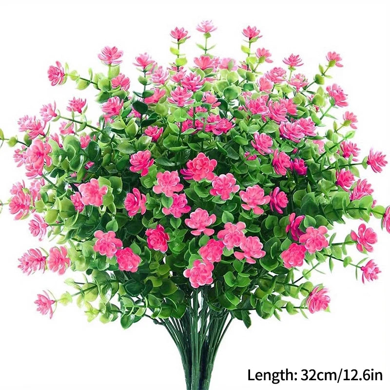 Un bouquet de fleurs artificielles roses et vertes pour décoration d'automne ou d'Halloween.