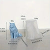 A light blue silicone mold shaped like a cat, next to its corresponding white cylindrical piece.