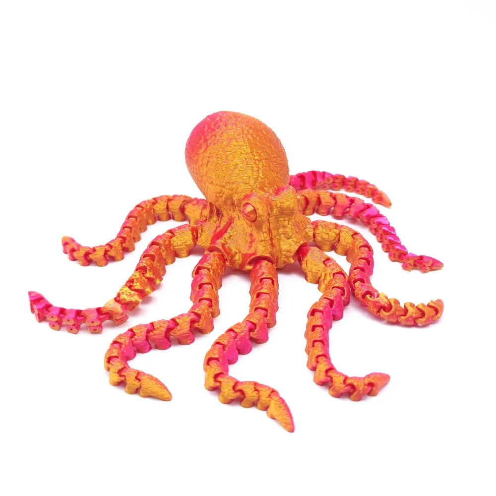 An articulated 3D printed octopus figurine with bright orange and pink tentacles.