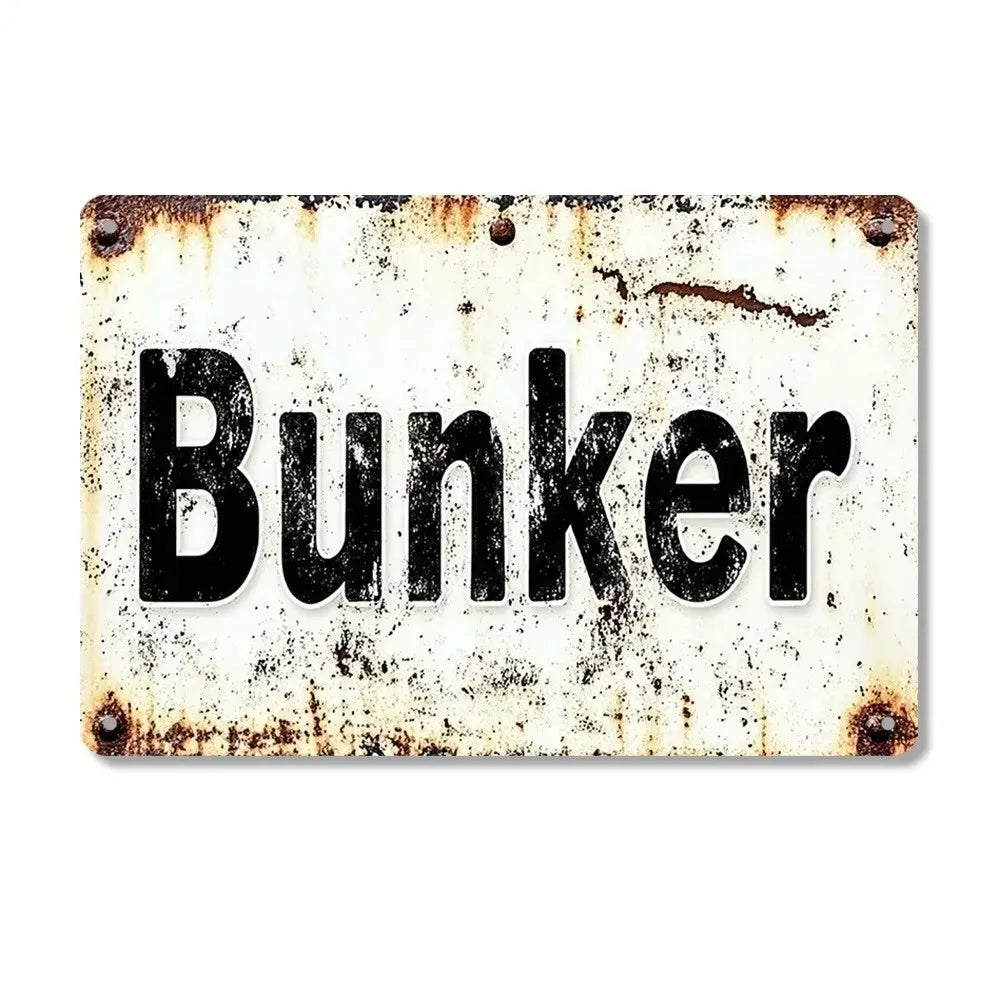A distressed, vintage metal tin sign with the word Bunker stamped in black text on a white background.