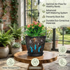 A set of six round plastic plant pots with drainage saucers displayed on a wooden table.
