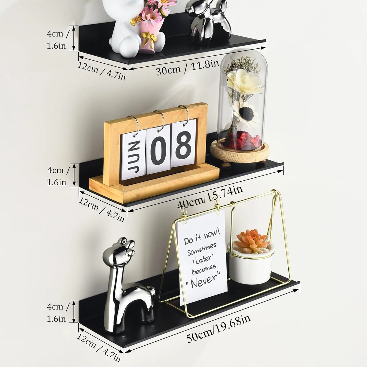 A set of floating metal wall shelves displaying various decorative items like a white cat, flowers, and a glass vase.