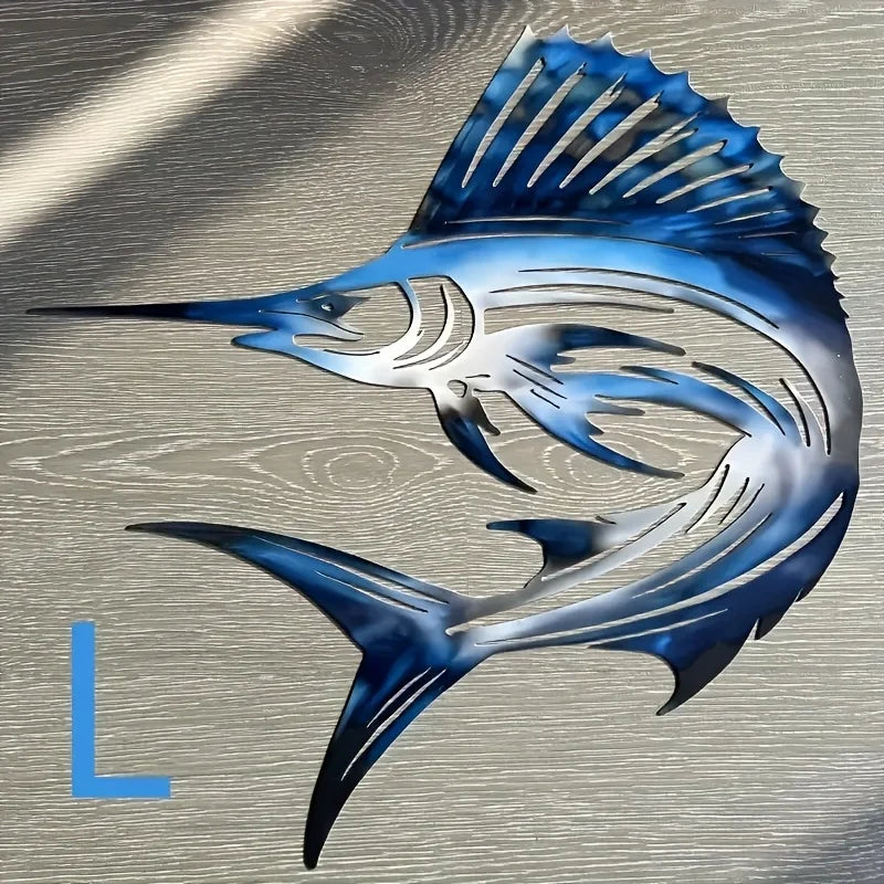 A stylized blue and silver metal fish silhouette wall art against a neutral background.