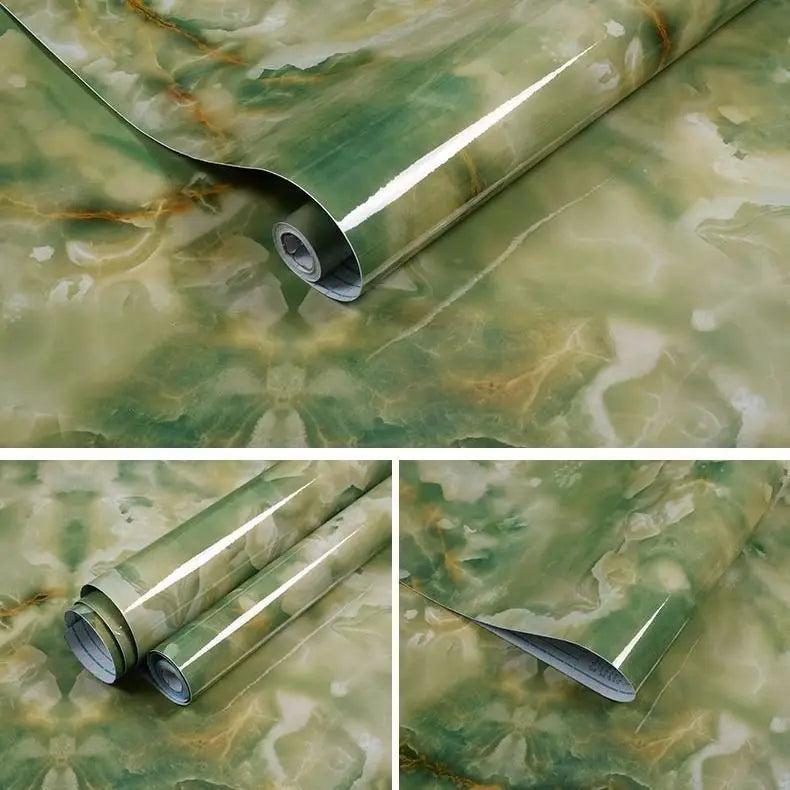 Roll of green and gold marble contact paper showing a curved section on a surface.