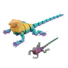 A yellow and blue articulated 3D printed lizard figurine with a long tail.