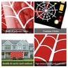 A red and white spider web banner for a birthday party, featuring a city skyline design.