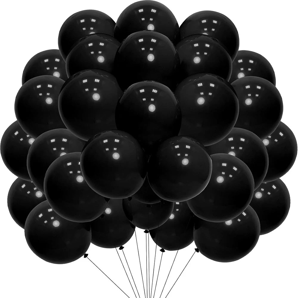A bunch of black latex balloons tied together for a party decoration.