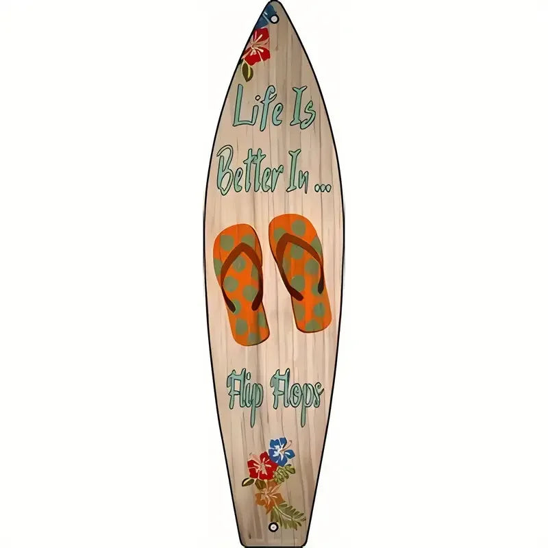 A wooden surfboard sign with the text Life Is Better In Flip Flops and floral decorations.