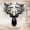 Black metal deer head wall sculpture with antlers and silhouette of birds on a wooden background.