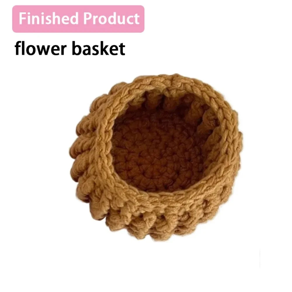 A finished, hand-crocheted flower basket made of brown yarn.