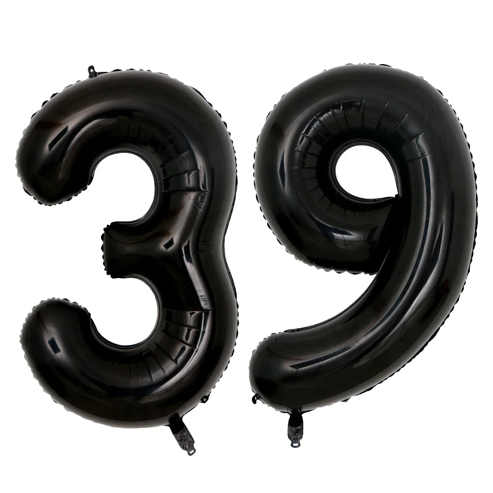 A set of two giant black foil balloons shaped like the number 39
