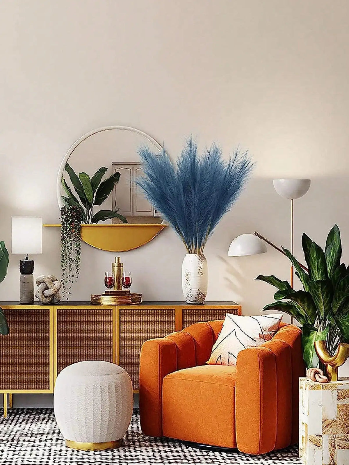 A vibrant orange armchair sits in a modern living space decorated with natural textures and gold accents.