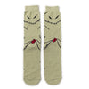 Pair of beige crew socks featuring black printed skulls and alien faces