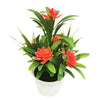 Artificial lotus flowers in a potted plant used as desk decor