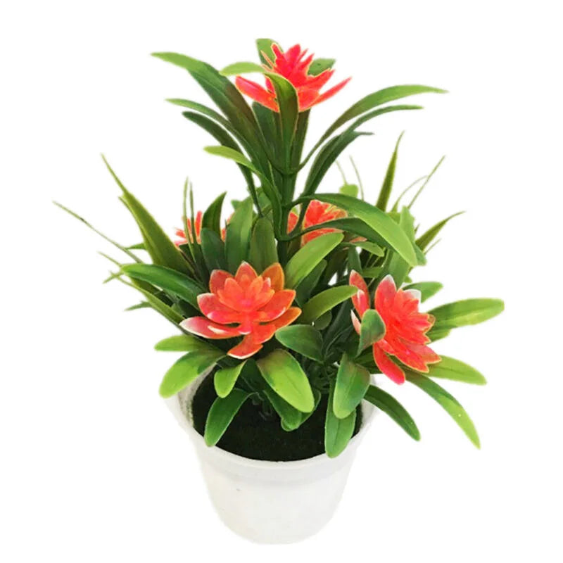 Artificial lotus flowers in a potted plant used as desk decor