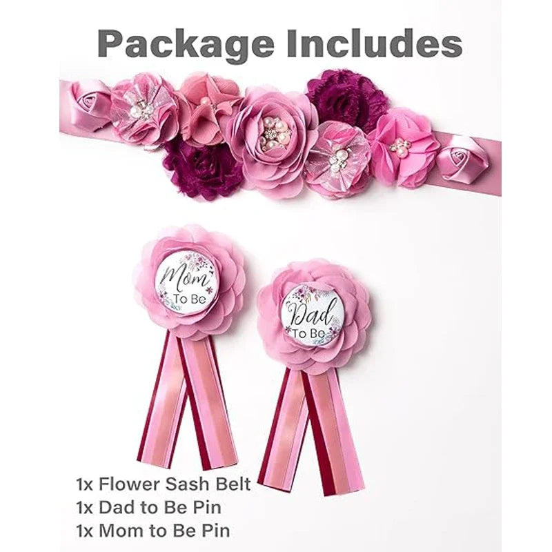 A package of pink floral maternity sash belts and pins for a baby shower