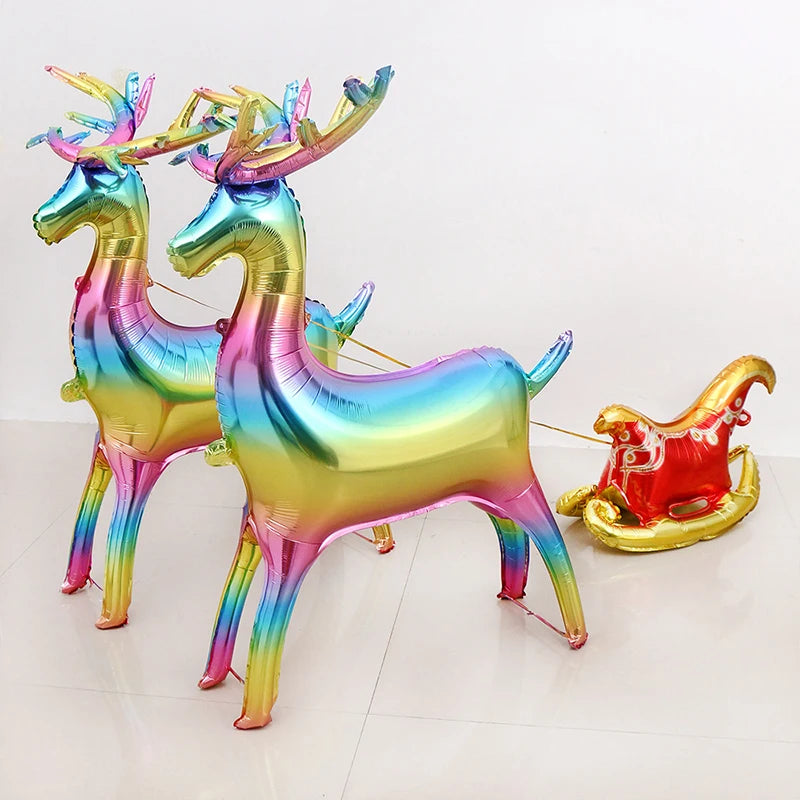 A set of two iridescent foil balloons shaped like deer with antlers, featuring a rainbow gradient color scheme.