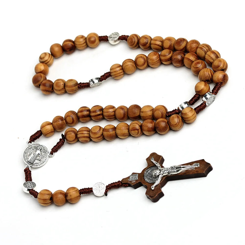 A wooden bead rosary cross necklace featuring natural wood beads and silver accents.