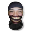 A person wearing a black headgear mask with exaggerated, smiling facial makeup for cosplay.