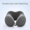 A gray U-shaped memory foam neck pillow shown from the front.