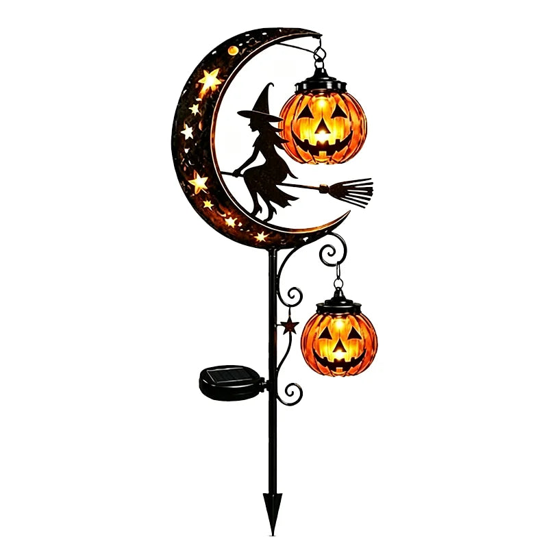 A black silhouette of a witch on a crescent moon lantern with a glowing jack-o'-lantern.
