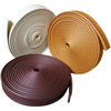 Rolls of self-adhesive flexible wall skirting strips in beige and brown colors.
