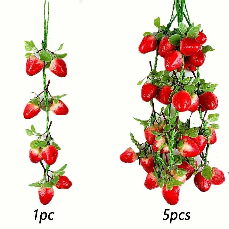 A string of artificial strawberries used for decoration or photography.