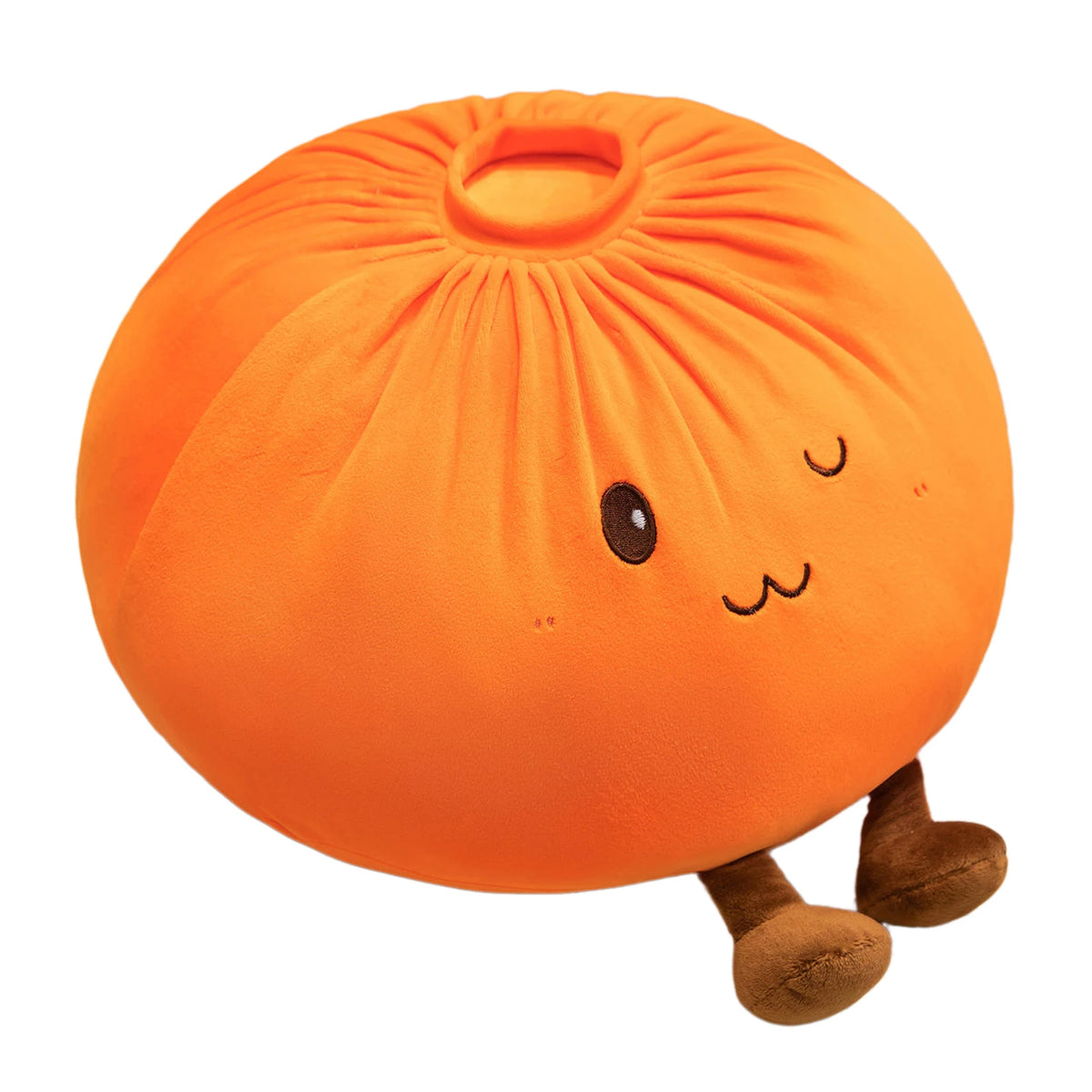 An orange dumpling plush pillow with small black eyes and brown feet.