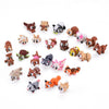 A collection of various small, articulated 3D animal figurines in brown, white, and orange colors.