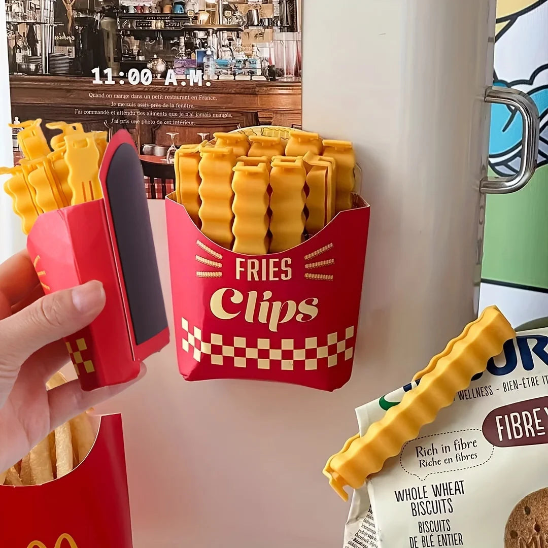 A hand holds a red clip container filled with yellow french fry shaped sealing clips.