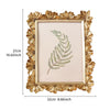A golden 3D resin photo frame with a floral border and a light pink mat, featuring a green fern design.