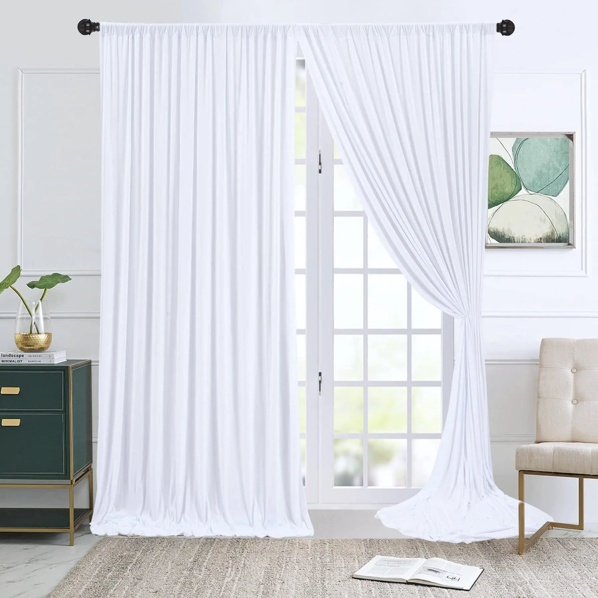 White wrinkle-free polyester backdrop curtains hanging in a doorway