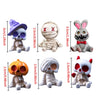 A set of four Halloween resin figurines depicting a skull, mummy, pumpkin, and rabbit.