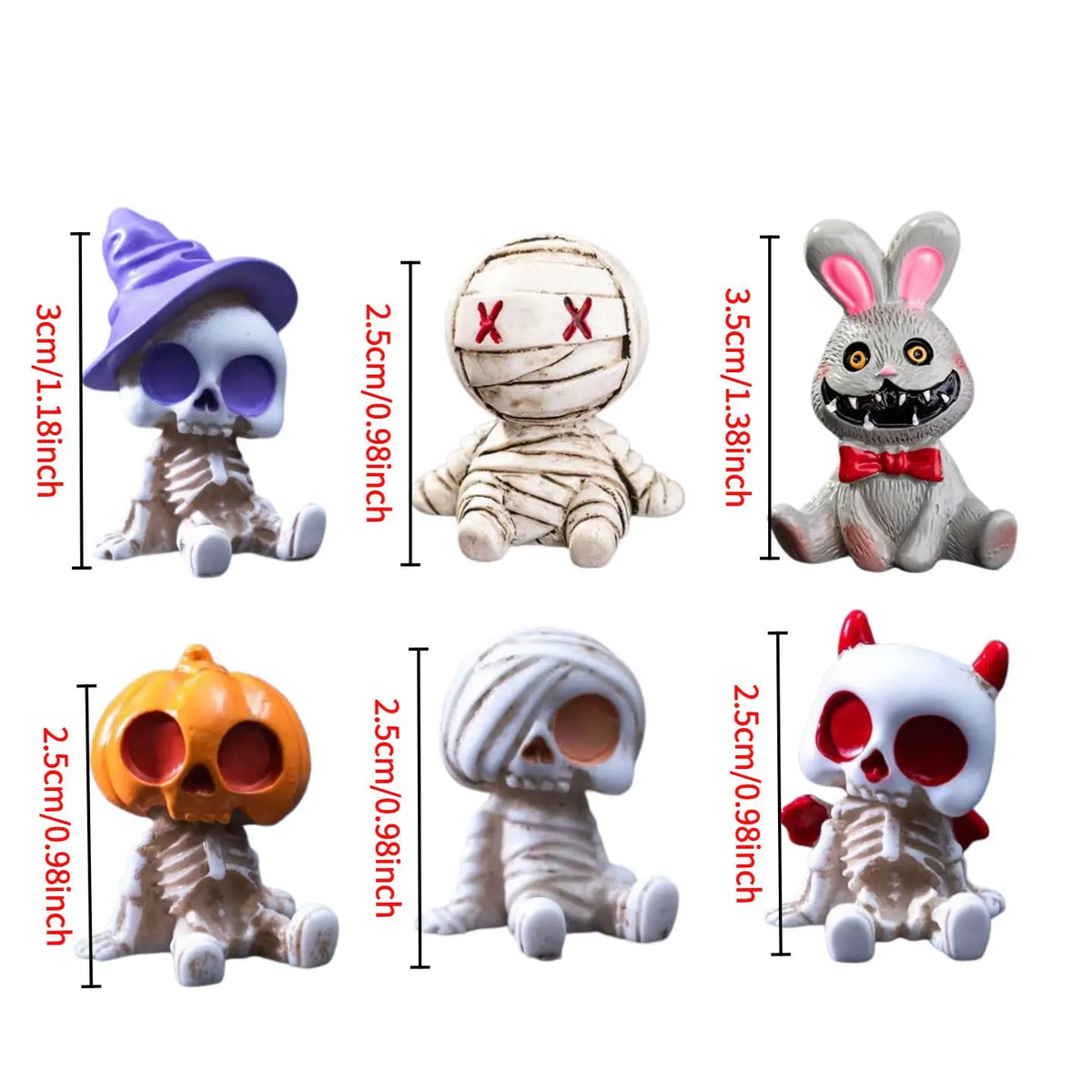 A set of four Halloween resin figurines depicting a skull, mummy, pumpkin, and rabbit.