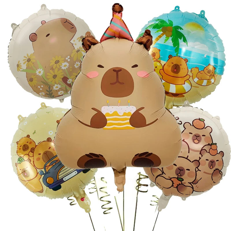 A set of cartoon capybara foil balloons in various colors and designs for parties.
