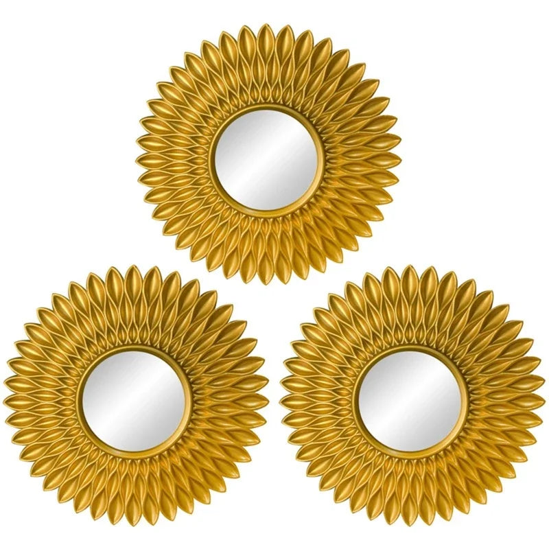 A set of three gold sunflower wall mirrors with oval mirrors for home decor