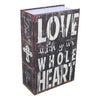 A dark wooden box with white text that reads LOVE with your WHOLE HEART on the front.