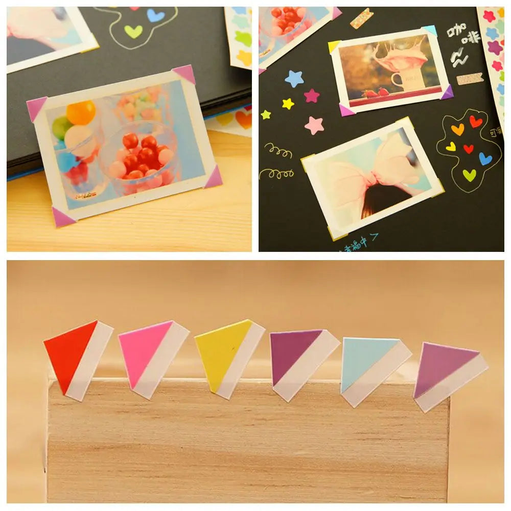 A collection of colorful PVC photo corner protectors in various pastel shades arranged on a wooden tray.