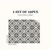 A set of 12 Moroccan pattern floor stickers featuring intricate black and white geometric designs.