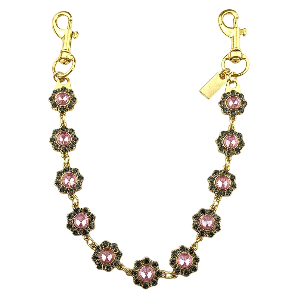Gold chain bag strap with pink and black floral charms and a clasp.