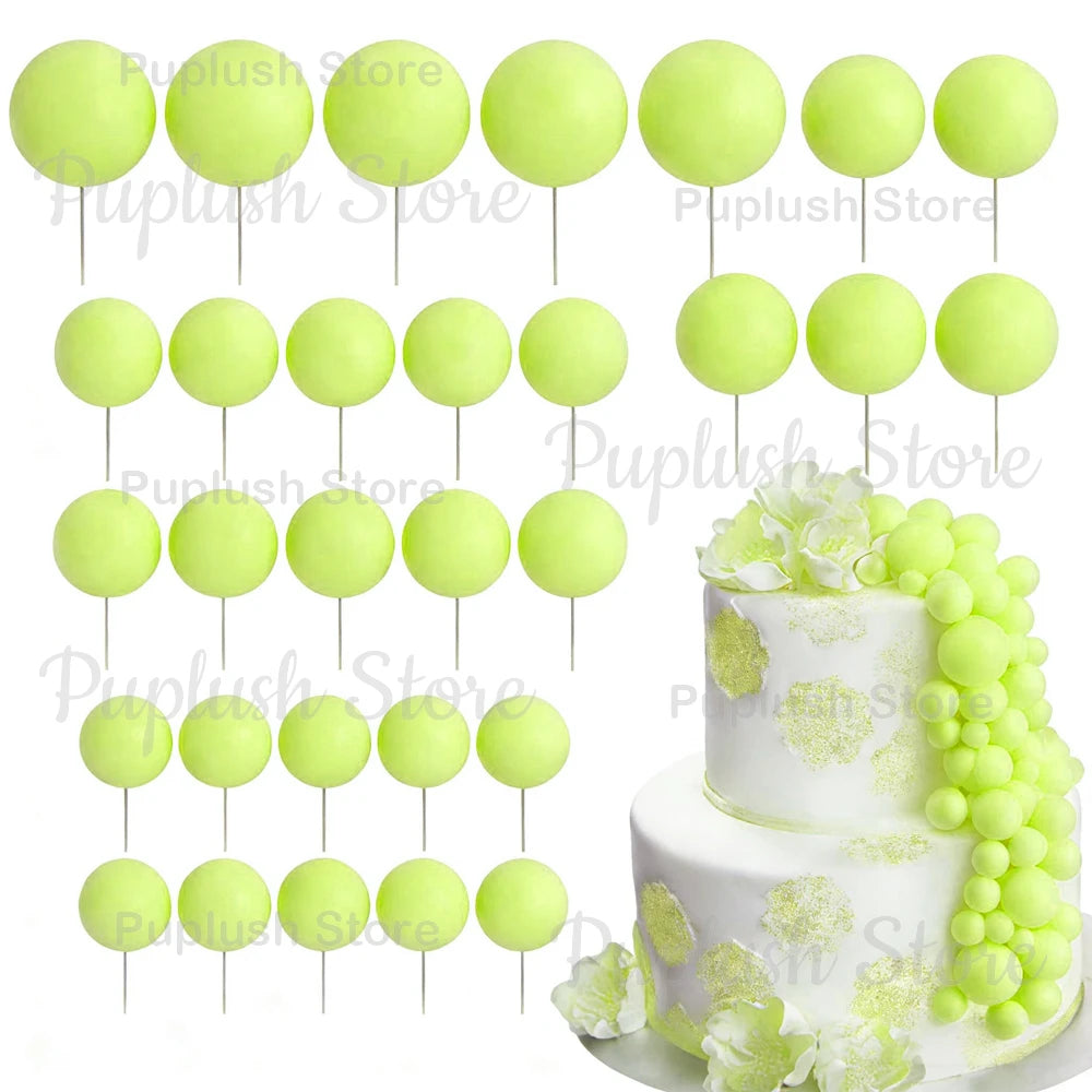 A set of light green foam cake toppers, including various sizes and shapes, displayed against a white background.