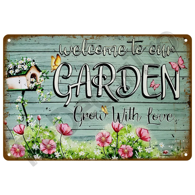 A vintage metal tin sign with the text Welcome to our Garden Grow With Love surrounded by flowers and butterflies.